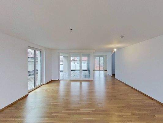 Ansicht I: Wohn- und Esszimmer mit offenem Küchenbereich