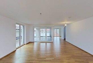 Ansicht I: Wohn- und Esszimmer mit offenem Küchenbereich