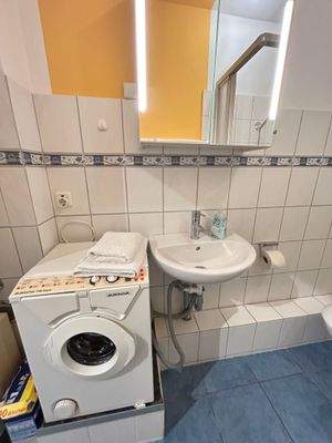 Duschbad mit Waschmaschine