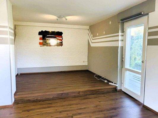 Wohnzimmer mit Zugang zur Terrasse