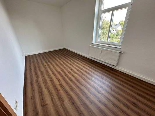 Leeres Zimmer mit Holzboden