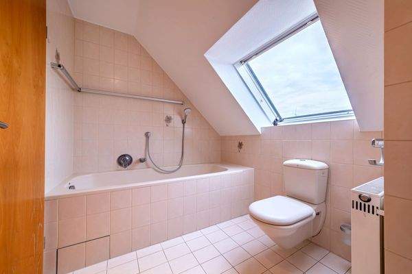 Level 2: Bathroom with natural light and bathtub