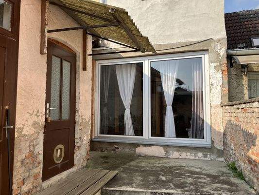 Wohnzimmerfesnter / Balkontür und Anbau