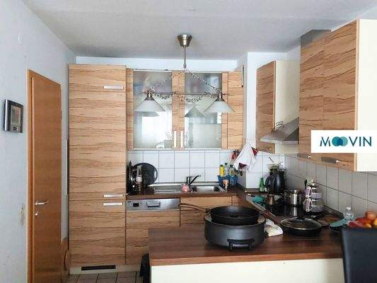 Ansicht III: Wohn- und Esszimmer mit offenem Küchenbereich