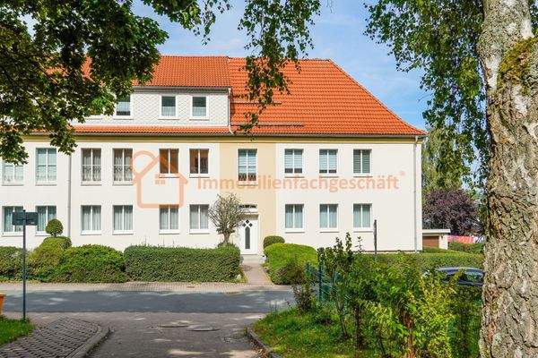 Hausansicht mit Logo