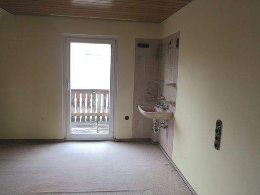 Schlafzimmer mit Zugang auf den Balkon