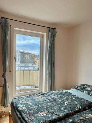 Schlafzimmer mit Balkon