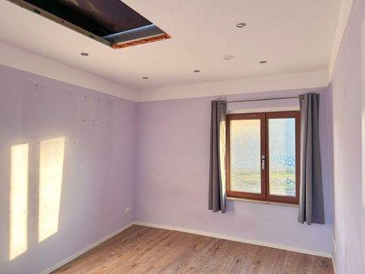 Schlafzimmer mit Spitzboden