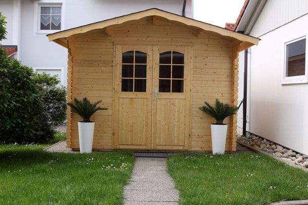 Multifunktionales Gartenhaus: Stauraum und Wohlfühloase in Holzbauweise