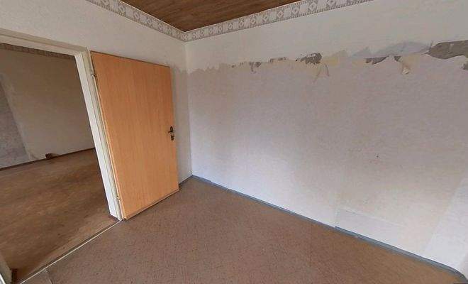 Schlafzimmer mit Durchgang zum Wohnzimmer