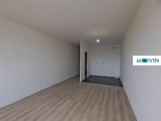 Ansicht IV: Wohn- und Schlafzimmer mit offenem Küchenbereich