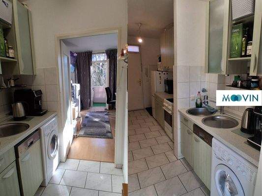 Ansicht II: Flur mit Einbauküche