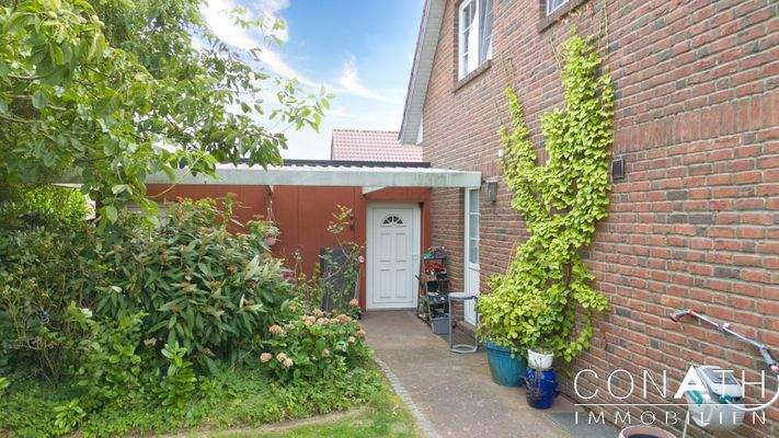 Conath-Immobilien_Harsefeld_Buxtehude_Fredenbeck – überdachte Sitzmöglichkeit mit Zugang zur Garage