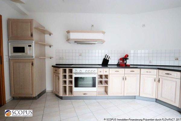 Küche mit Einbauküche - Ansicht 1