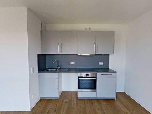 Ansicht II: Wohn- und Esszimmer mit offenem Küchenbereich