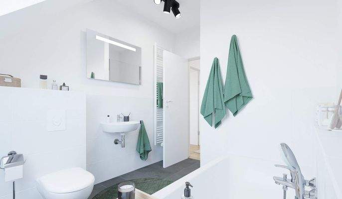 Ein modern gefliestes Badezimmer mit Badewanne und