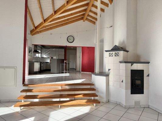 Wohn-/Essbereich mit Ofen Obergeschosswohnung