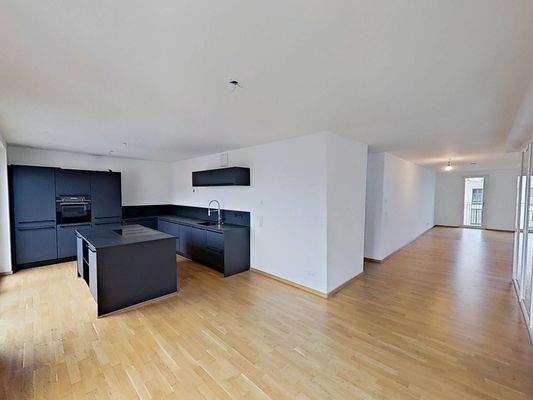 Ansicht III: Wohn- und Esszimmer mit offenem Küchenbereich