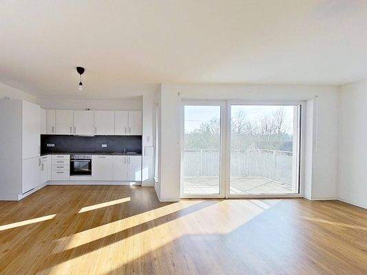 Ansicht II: Wohn- und Esszimmer mit offenem Küchenbereich