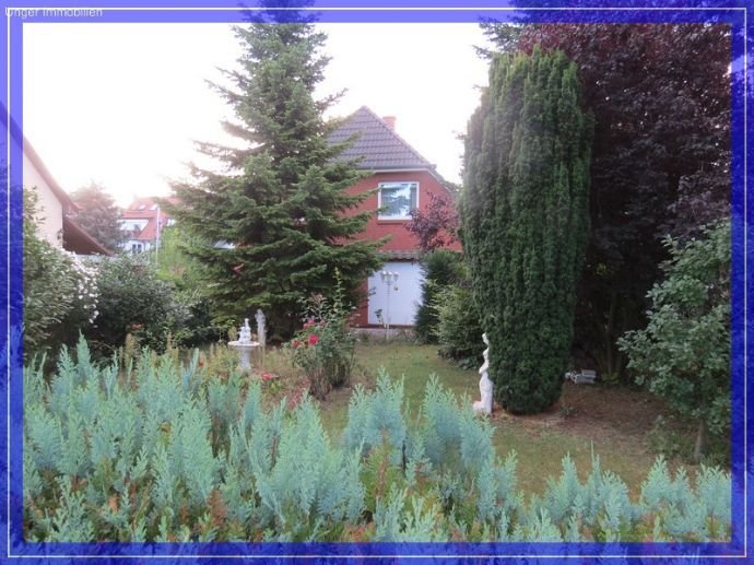 Verklinkertes Einfamilienhaus mit Kamin + Wintergarten in toller Lage