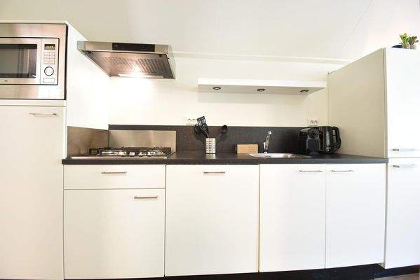 chalet-kaufen-arnhem-offene-kuche-wohnzimmer-modern-2025.webp004