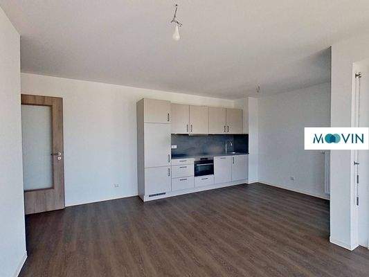 Ansicht IV: Wohn- und Esszimmer mit offenem Küchenbereich