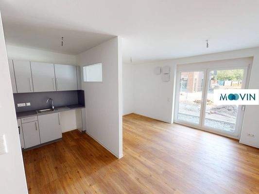 Ansicht I: Wohn- und Schlafzimmer mit offenem Küchenbereich