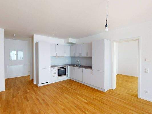 Ansicht III: Wohn- und Esszimmer mit offenem Küchenbereich