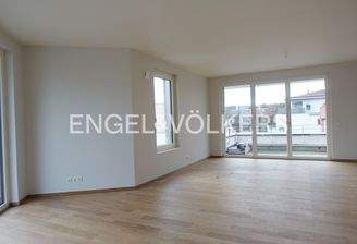 Offener Wohn- & Essbereich mit Zugang zu den Dachterrassen