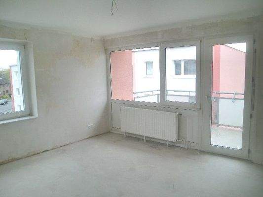 Wohnzimmer mit Balkon