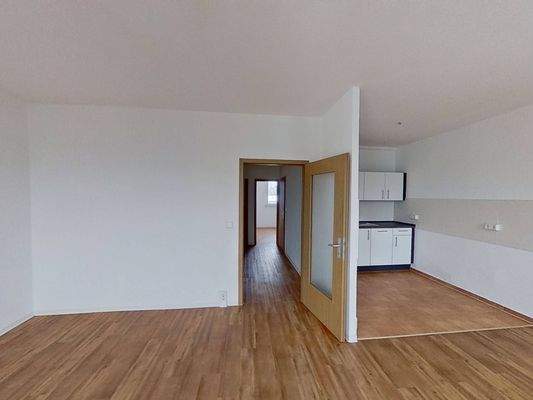 Ansicht IV: Wohn- und Esszimmer mit offenem Küchenbereich