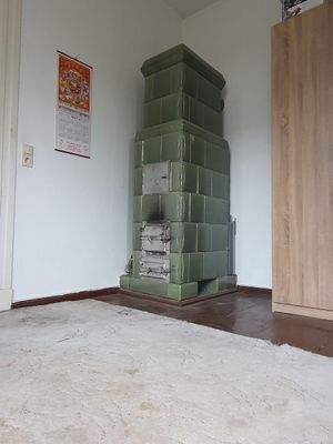 OG Kachelofen im Schlafzimmer