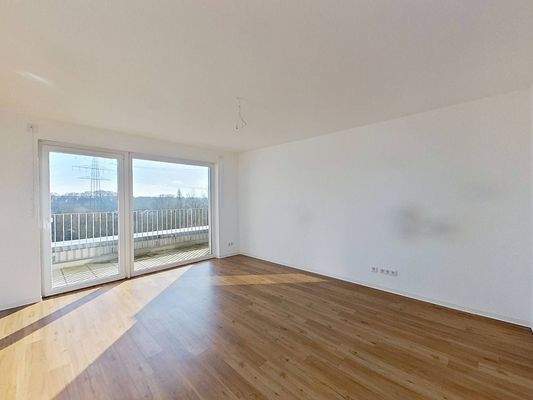 Ansicht II: Wohn- und Esszimmer mit offenem Küchenbereich