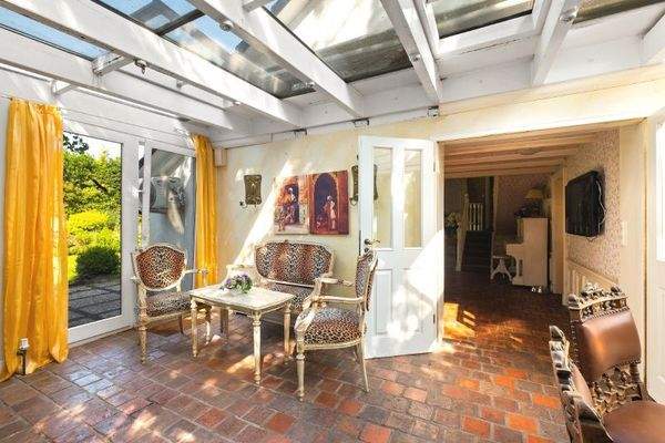 Wintergarten mit Kaminofen