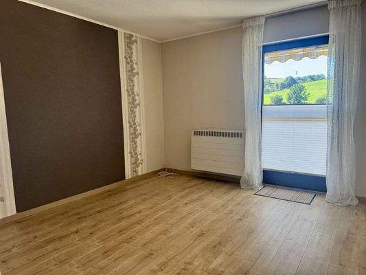 Schlafzimmer mit Balkonzugang