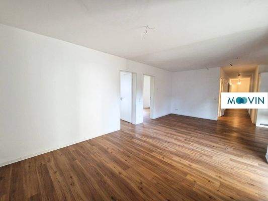 Ansicht III: Wohn- und Esszimmer mit offenem Küchenbereich