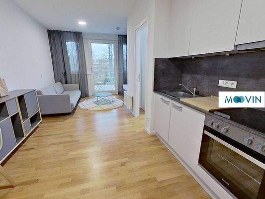 Ansicht I: Wohn- und Schlafzimmer mit offenem Küchenbereich