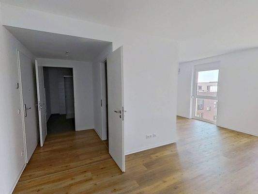 Ansicht III: Wohn- und Esszimmer mit offenem Küchenbereich