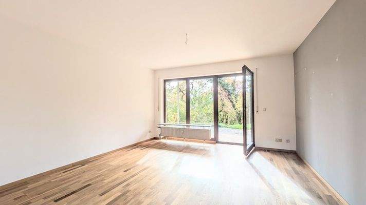 Wohnzimmer mit Zugang zur Terrasse