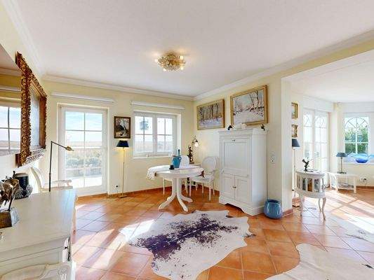 Wohnzimmer mit Zugang zur Terrasse im Erdgeschoss - Wohnung 1