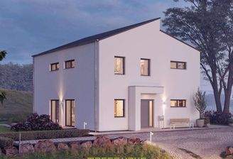 Dieses massa haus Fertighaus Einfamilienhaus im Lifestyle-Design präsentiert sich bei Dämmerung mit