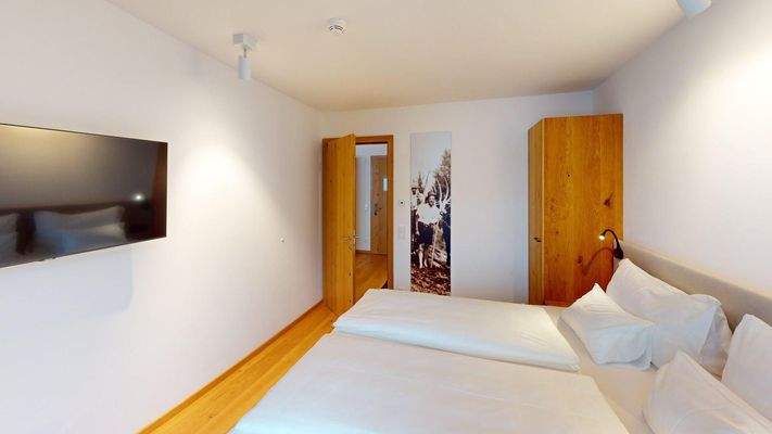 Apartment-201-ASR-FIEBERBRUNN-Bedroom 1.jpg