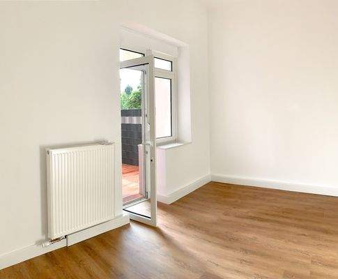 Schlafzimmer mit Zugang zur Terrasse