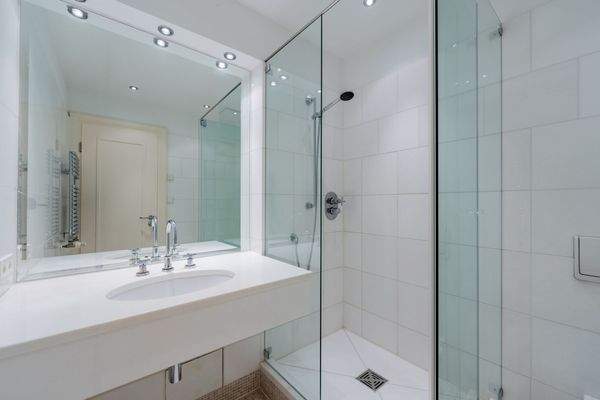 Timeless guest bathroom with glass shower
