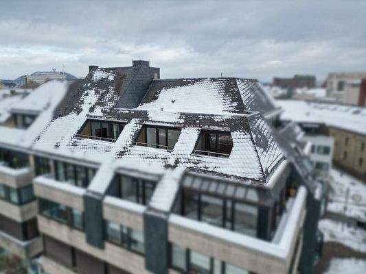 Außenansicht Dachgeschosswohnung mit drei Terrassen 