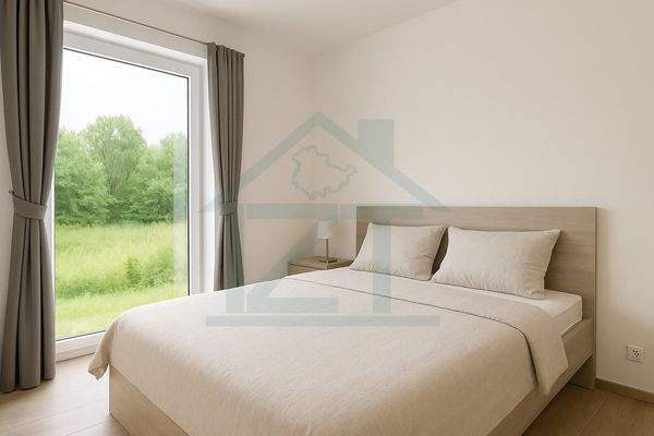 Helles Schlafzimmer mit Blick ins Grüne