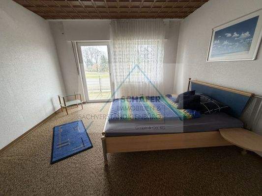 Schlafraum mit Balkonzugang