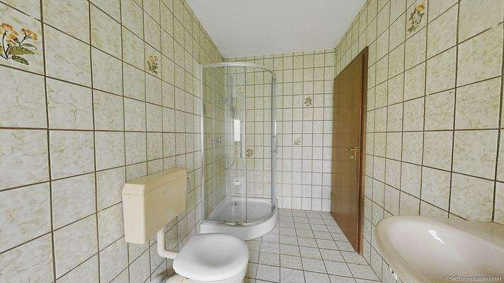 Das Badezimmer mit Dusche