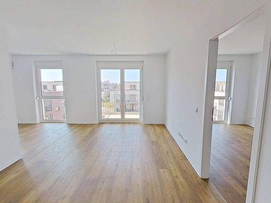 Ansicht II: Wohn- und Esszimmer mit offenem Küchenbereich