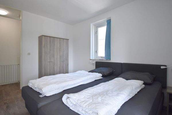 ferienwohnung-schlafzimmer-cap-helius-balcony-zuga